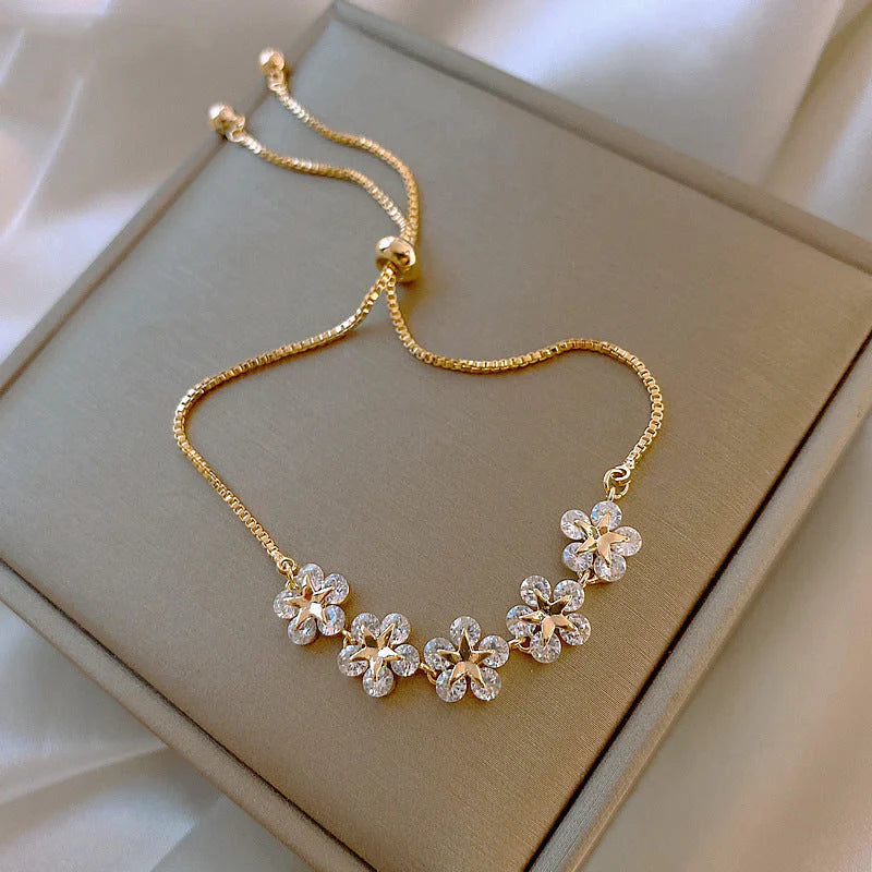 Gouden madeliefjesarmband